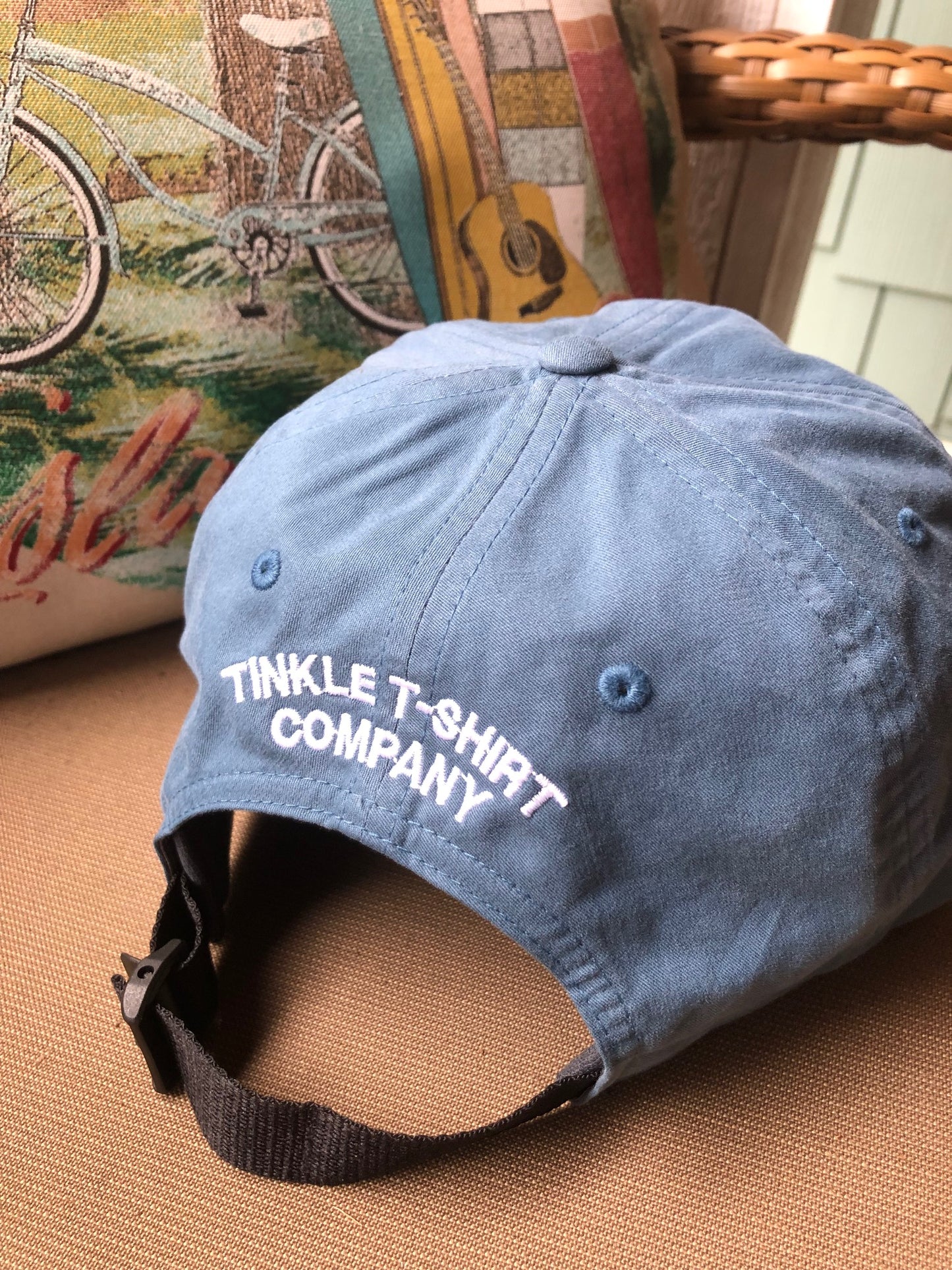 back of ocean tinkler baseball cap on it is embroidered TInkle T-Shirt Company