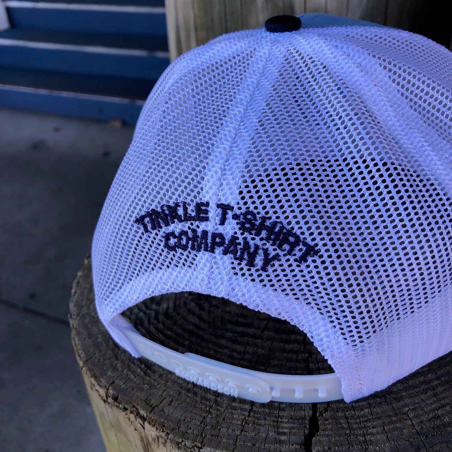 back of pool tinkler hat embroidered on white mesh is Tinkle T-Shirt Company