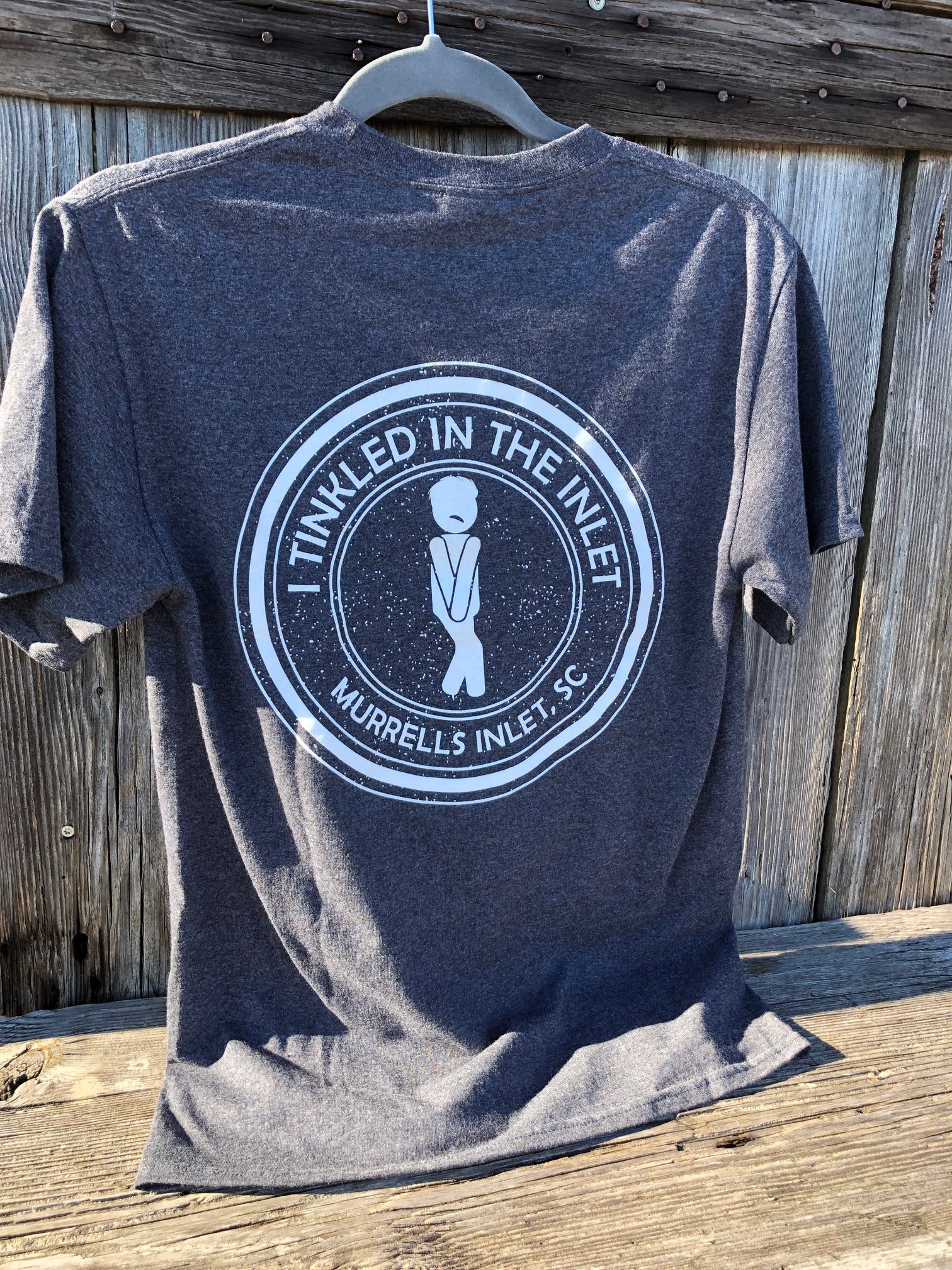 Back of grey heather t-shirt with I Tinkled in the Inlet Murrells Inlet SC design photographed at the marshwalk