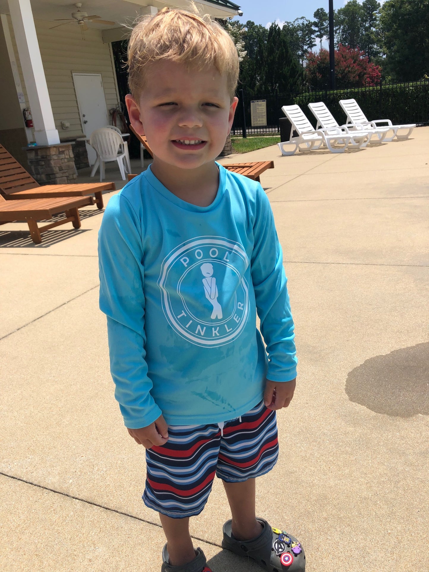 child wearing pool tinkler long sleeve spf  shirt