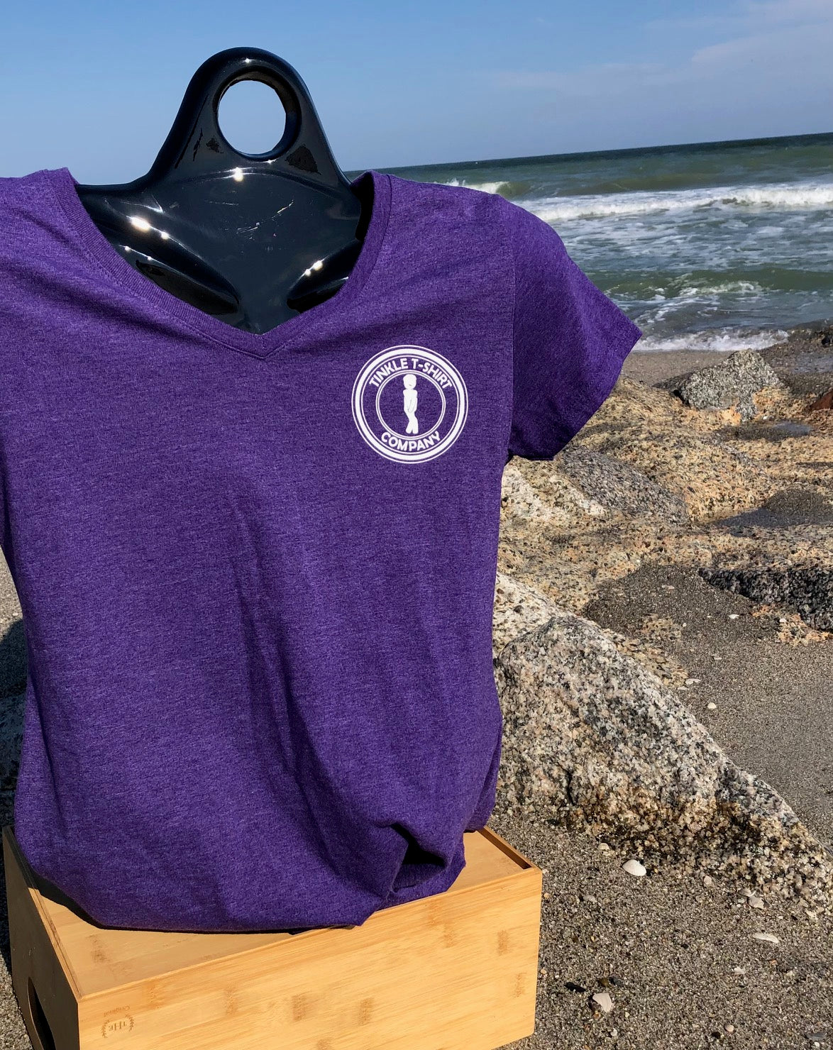 front of tinkle t shirt company womens purple heather ocean tinkler v neck